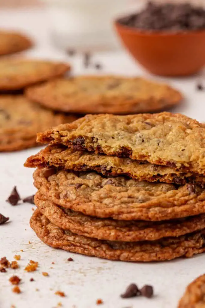 a stack of thin chocolate chip cookies