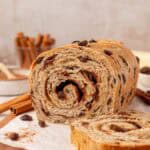 loaf of cinnamon raisin bread with a few slices missing