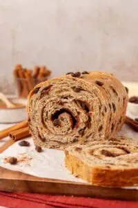 loaf of cinnamon raisin bread with a few slices missing