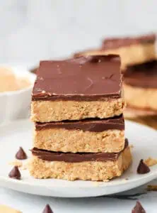three no bake peanut butter bars on a plate