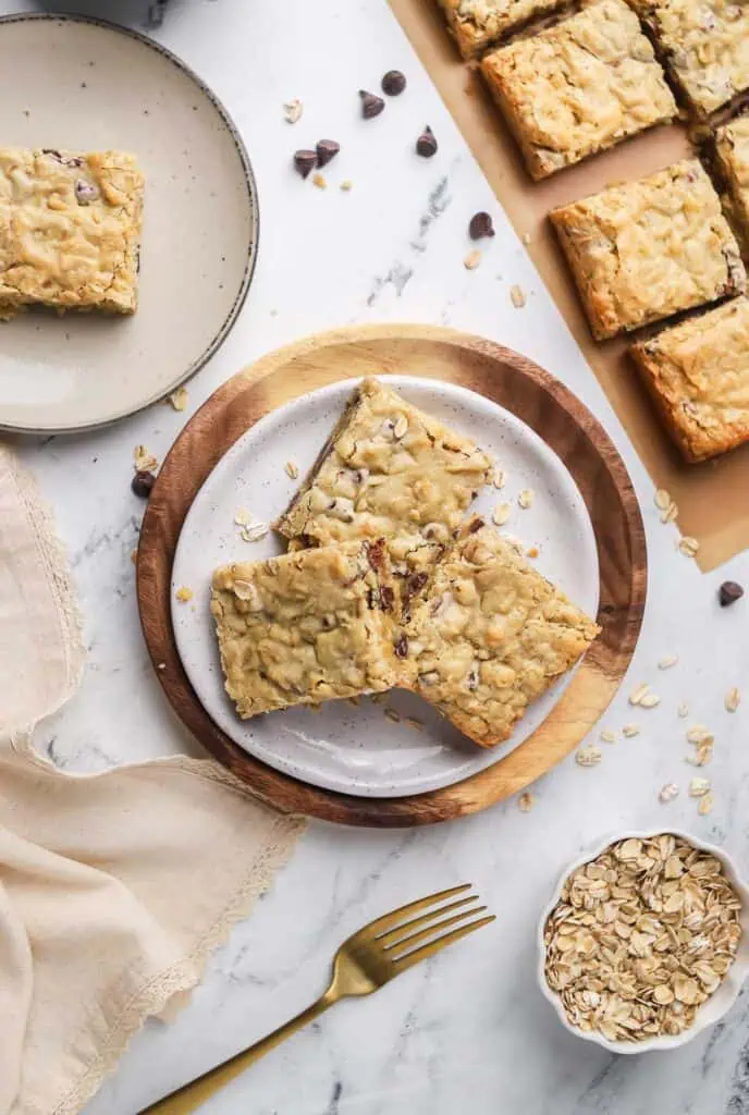 three oatmeal chocolate chipcookie bars on a plate