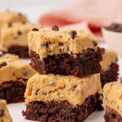 two cookie dough brownies stacked on top of each other