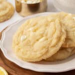 three lemon white chocolate chip cookies on a plat