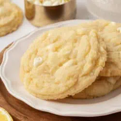 three lemon white chocolate chip cookies on a plat