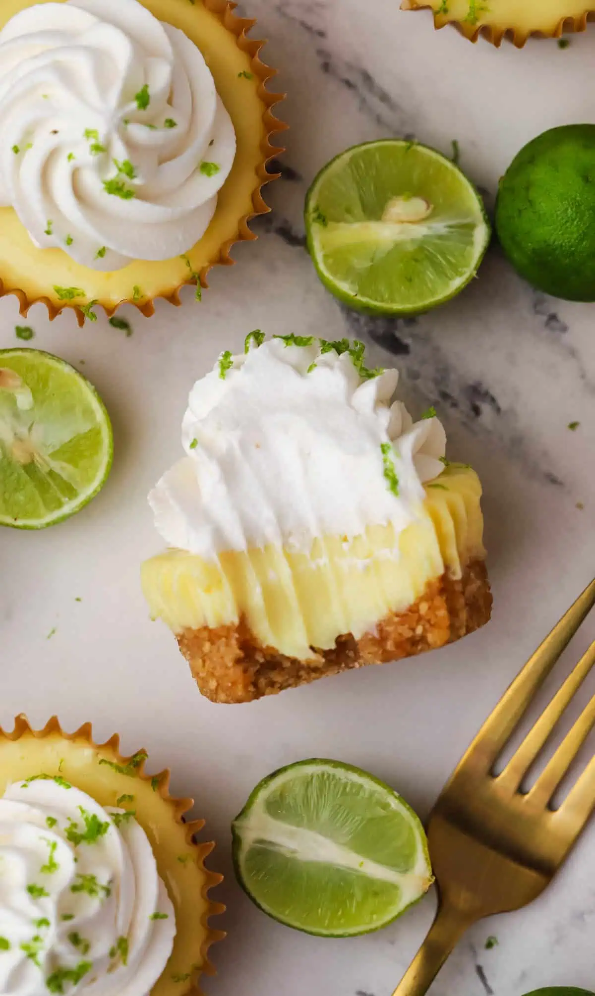 mini key lime pie on its side with a bite taken out of it