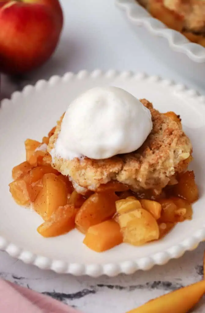 a plate of peach cobbler