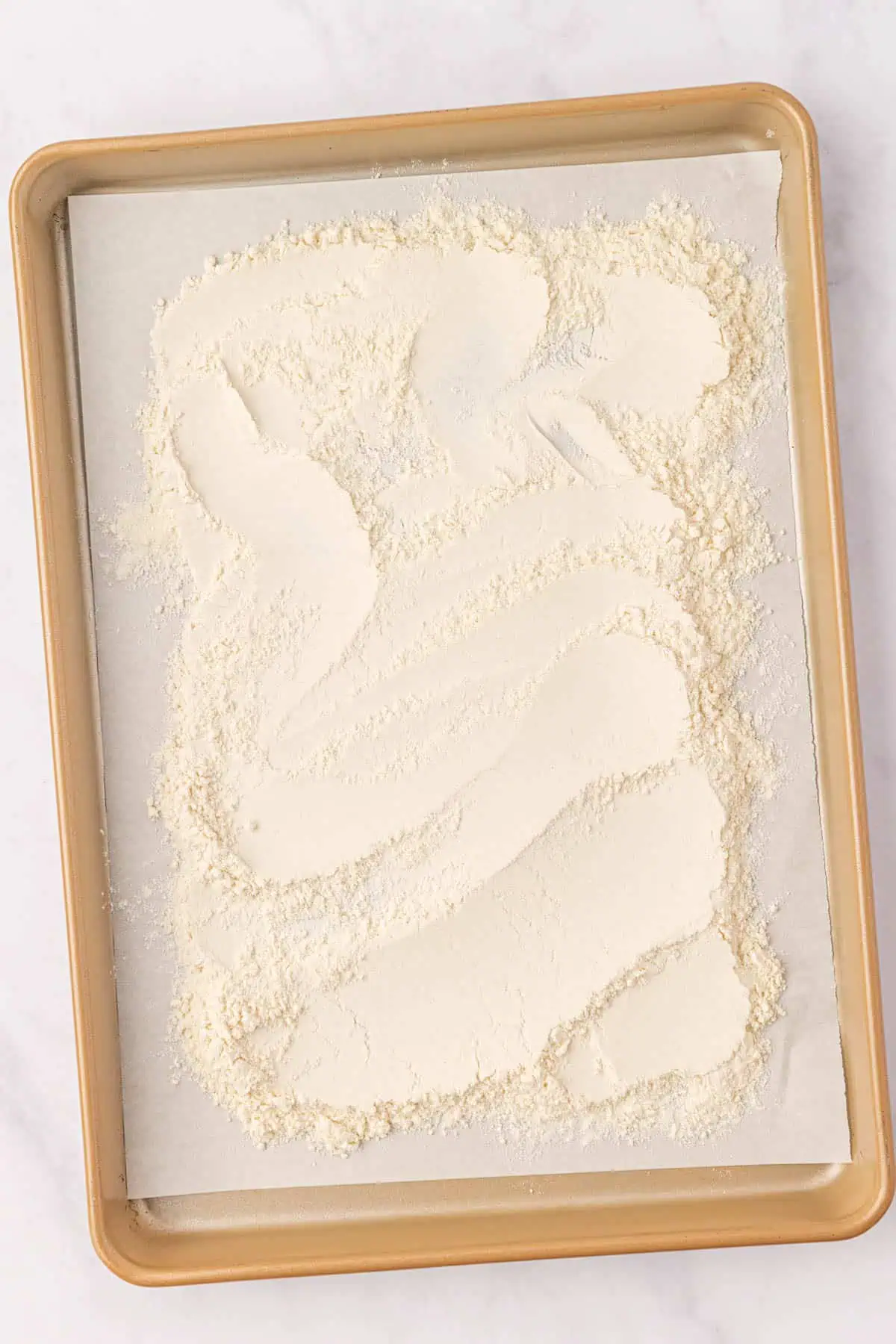 flour spread onto a cookie sheet