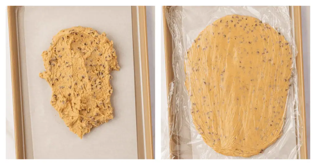 cookie dough spread onto a cookie sheet and flattened