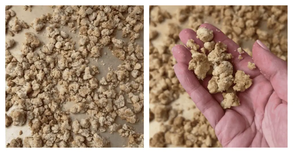 baked crumbs on a baking sheet and a hand holding up some
