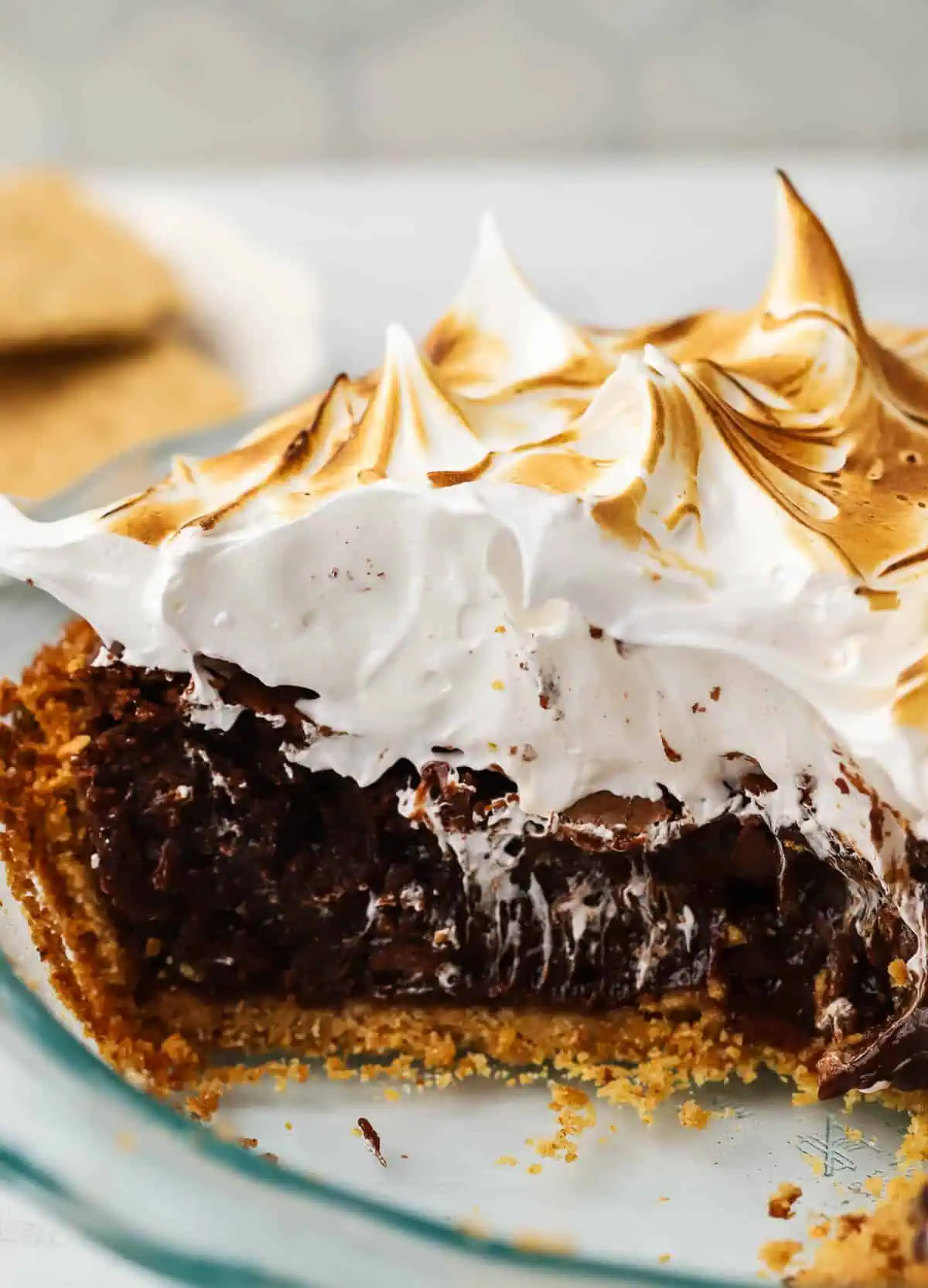 s'mores brownie pie with a slice missing from the plate