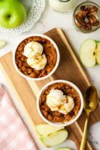two apple crumbles in ramekins