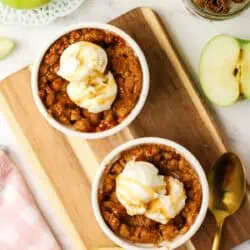 two apple crumbles in ramekins