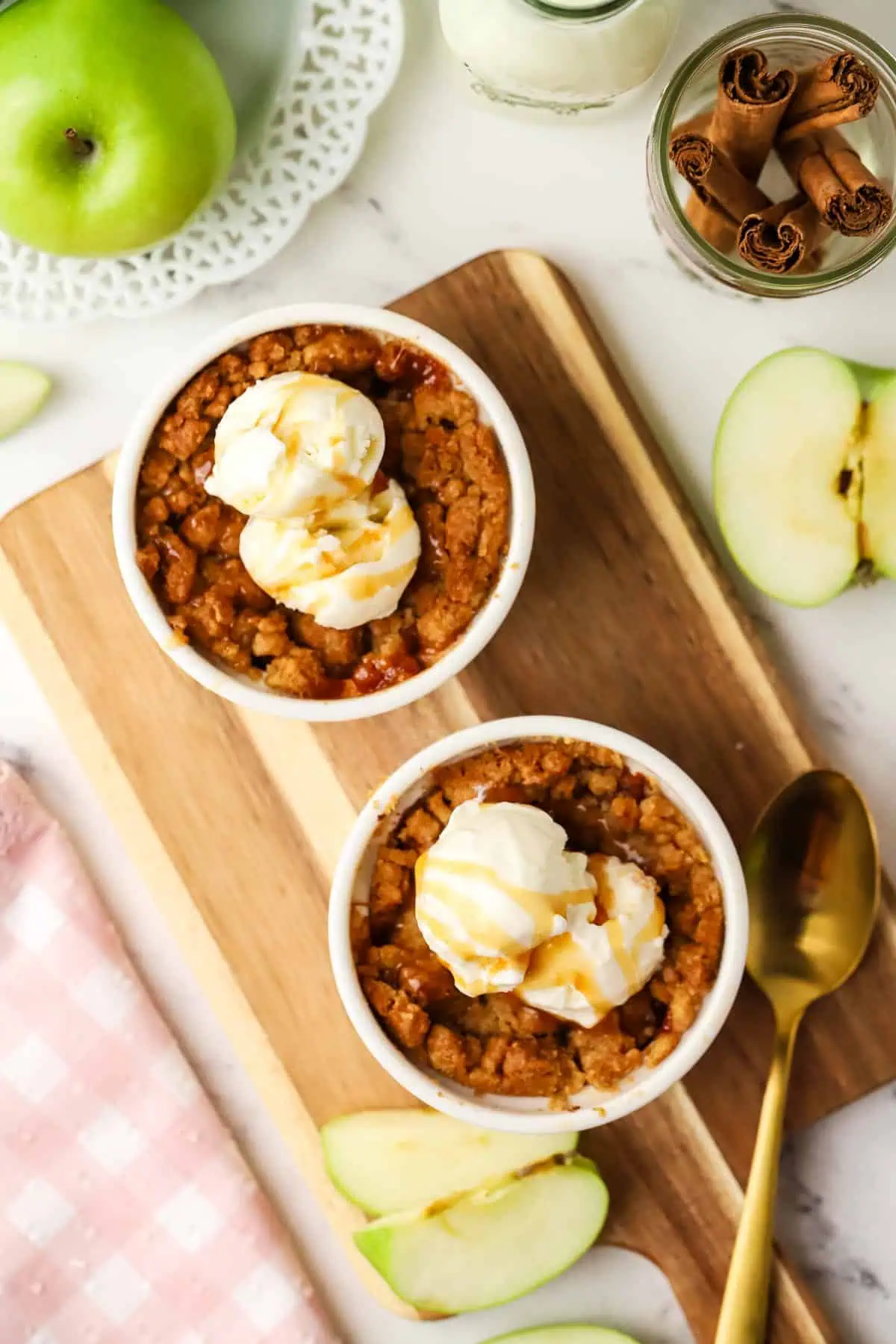 two apple crumbles in ramekins