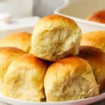 three Hawaiian rolls on a plate