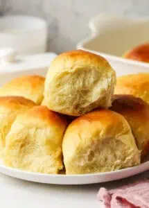 three Hawaiian rolls on a plate