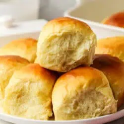 three Hawaiian rolls on a plate