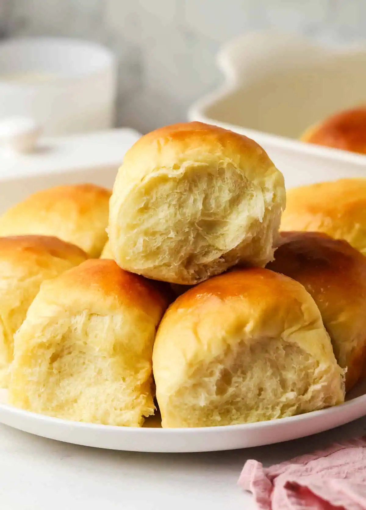 three Hawaiian rolls on a plate