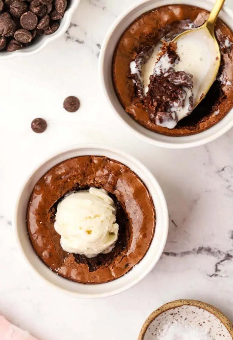 two brownie ramekins topped with ice cream