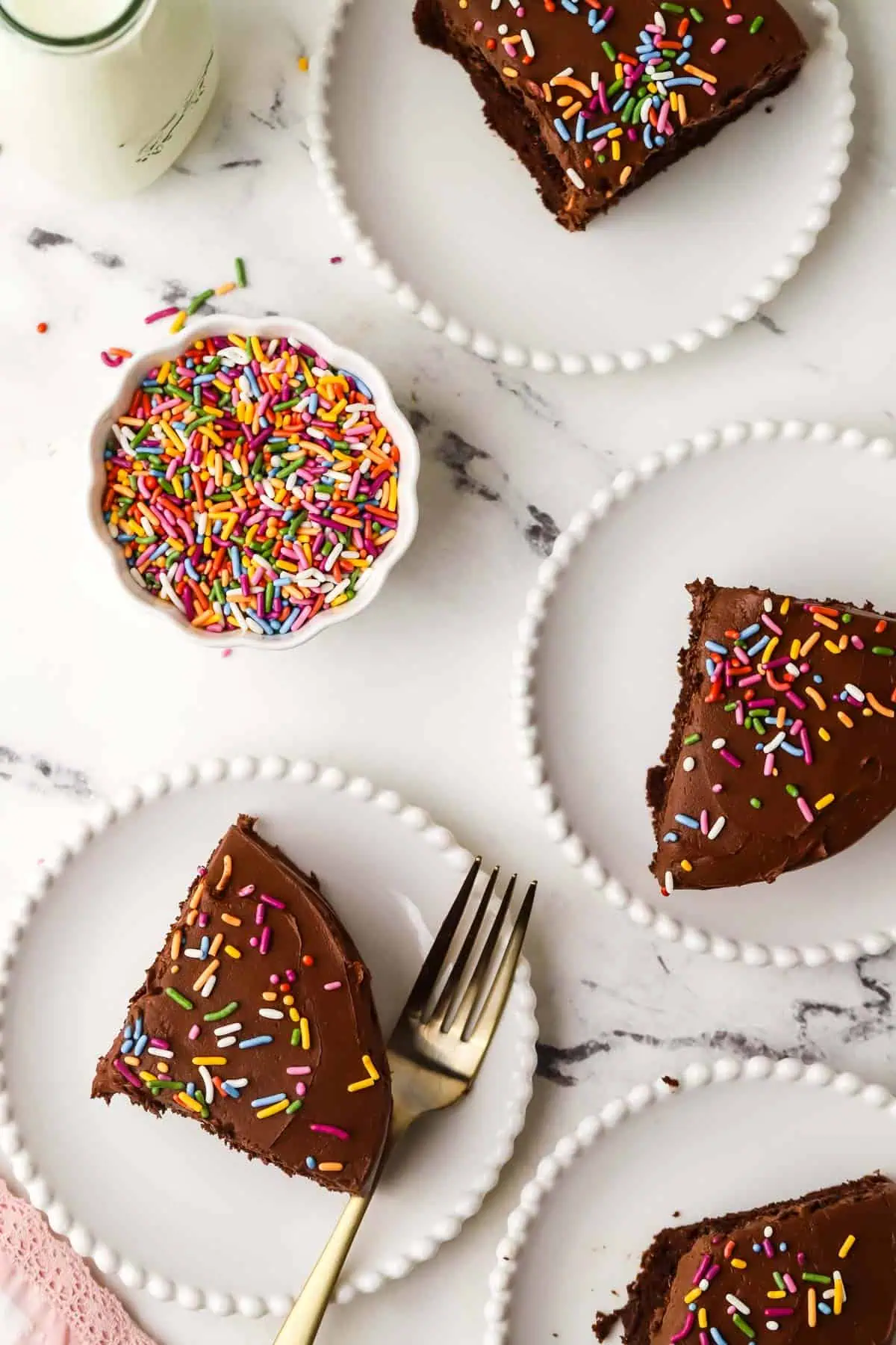 four cake slices on plates