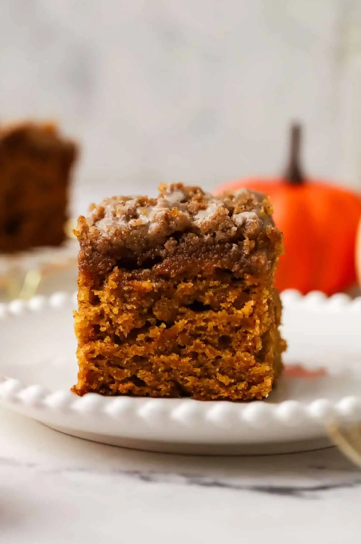 slice of small batch pumpkin coffee cake on a plate
