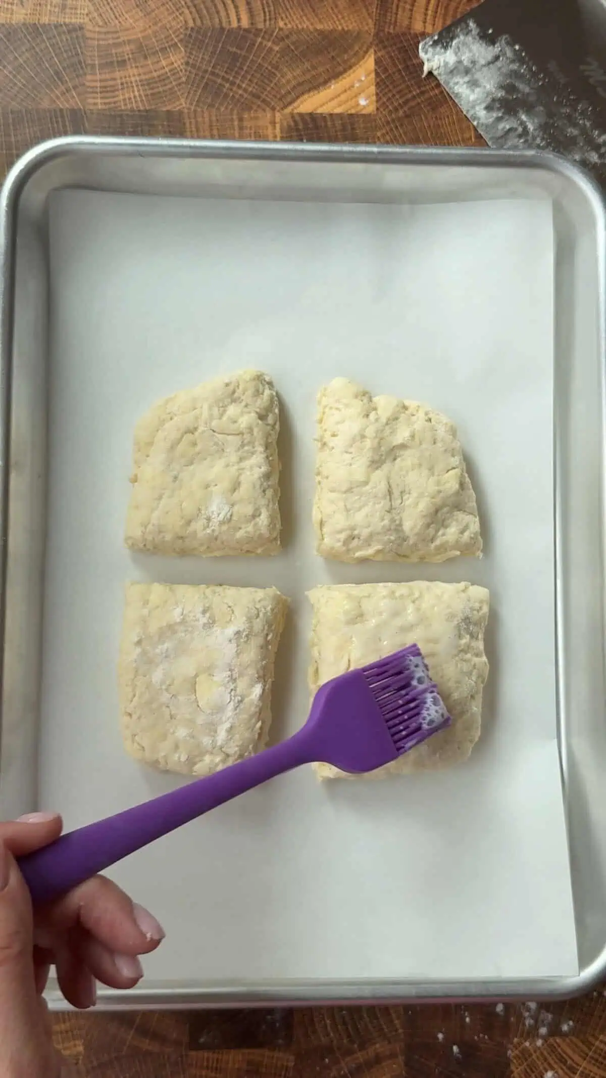 buttermilk brushed on top of biscuits