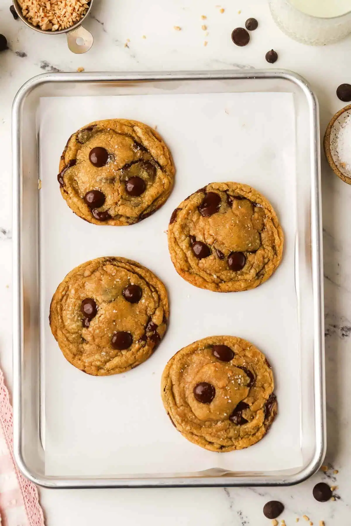 four cookies on a cookie sheet
