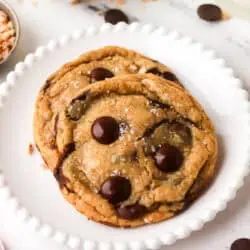 two brown butter toffee cookies on a plate