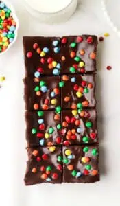 small batch cosmic brownies cut on a piece of parchment paper