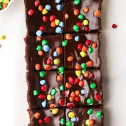 small batch cosmic brownies cut on a piece of parchment paper