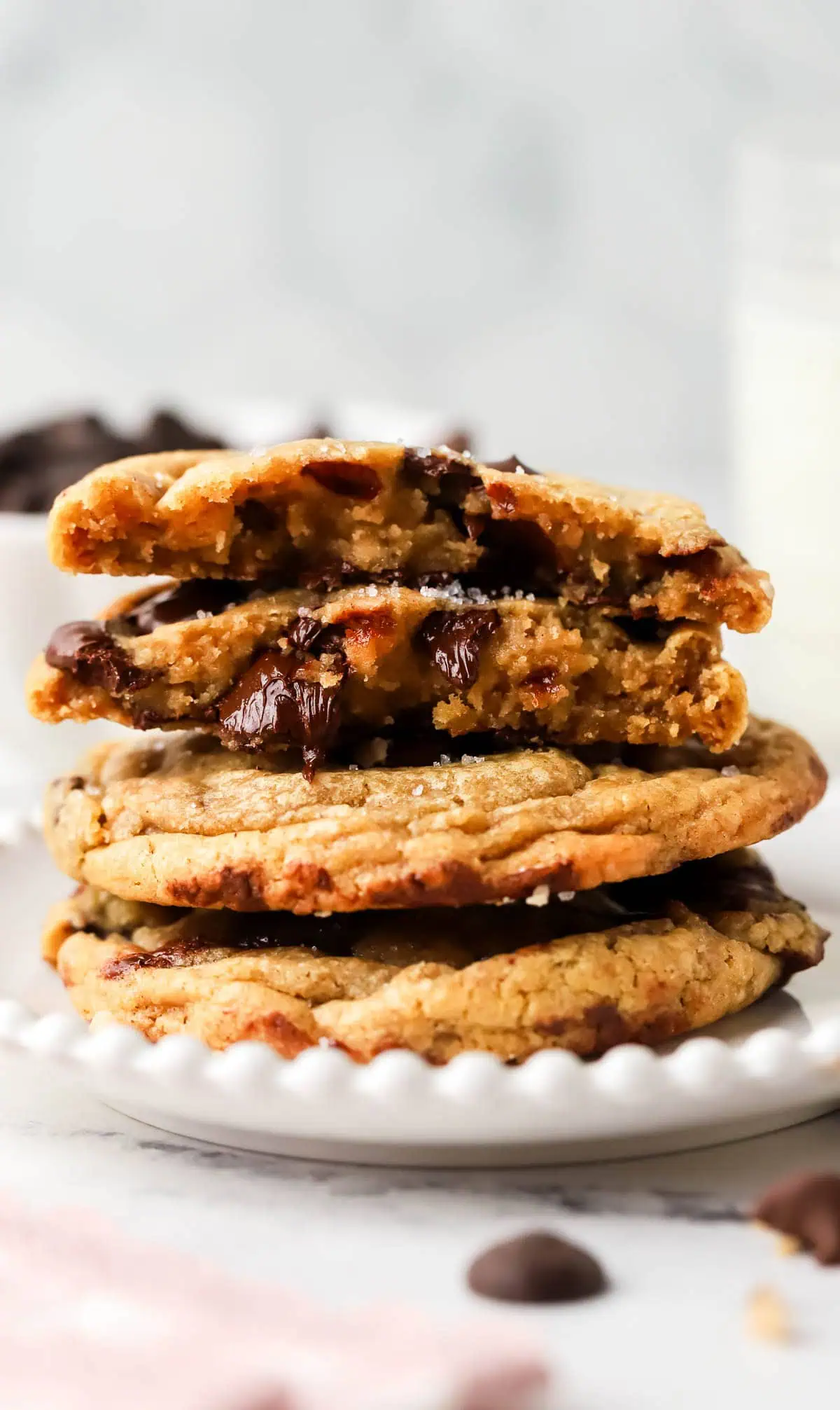four cookies stacked with top two cookies broke in half