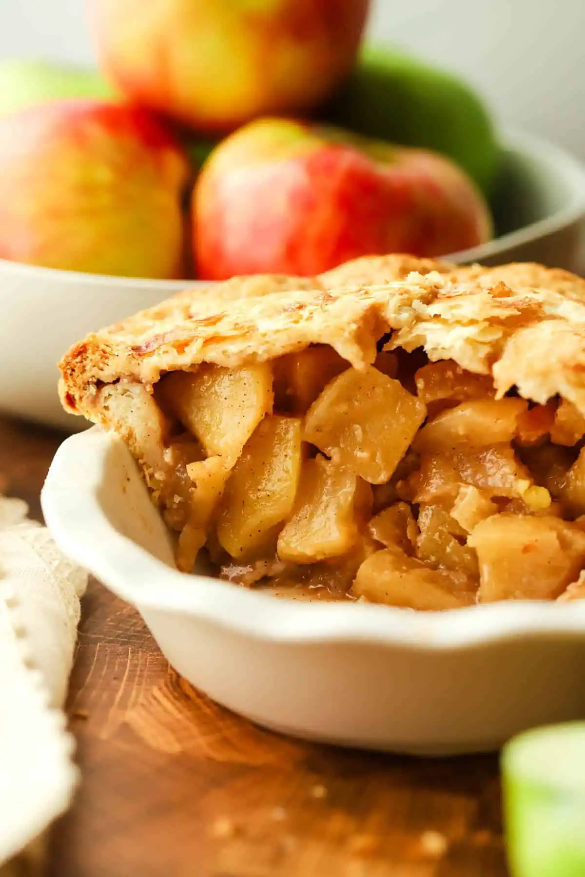 mini apple pie with a few pieces missing so you can see the interior