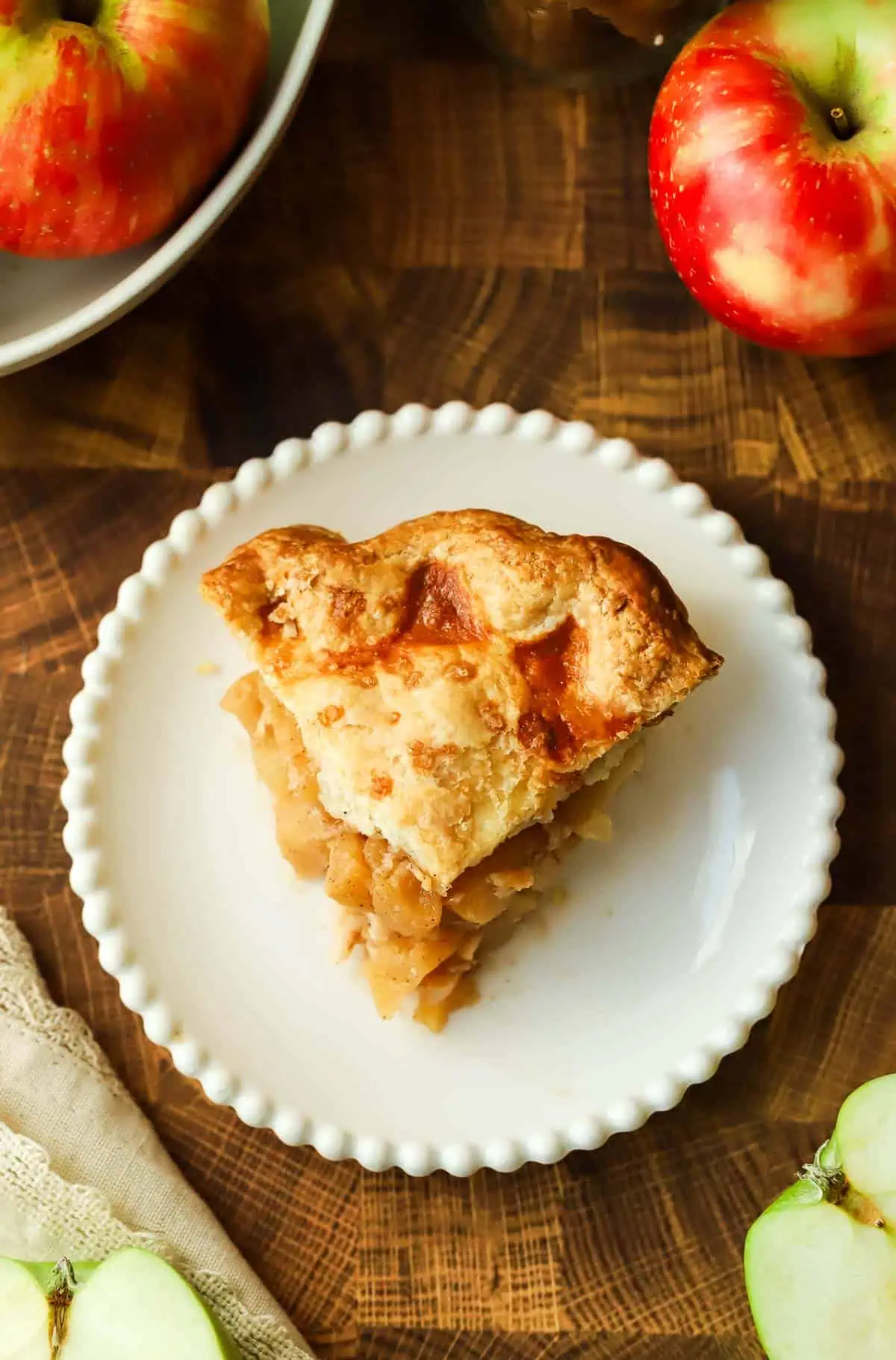 a slice of mini apple pie on a plate