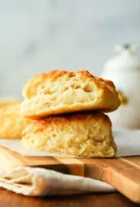 two buttermilk biscuits stacked on top of each other