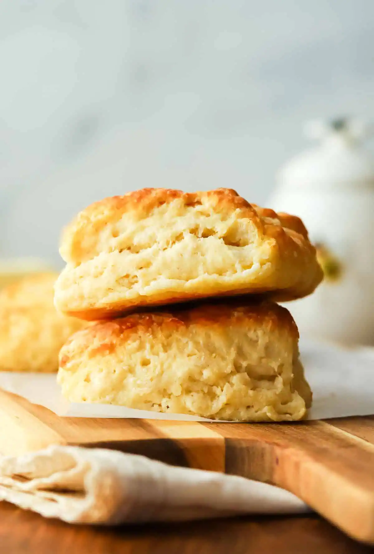two buttermilk biscuits stacked on top of each other