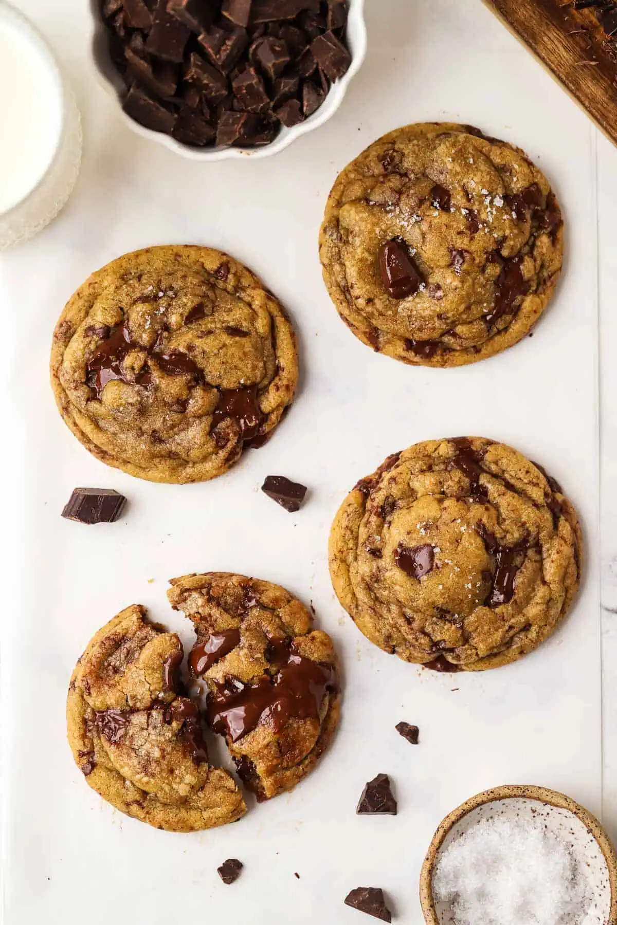 four small batch brown butter chocolate chip cookies on parchment paper