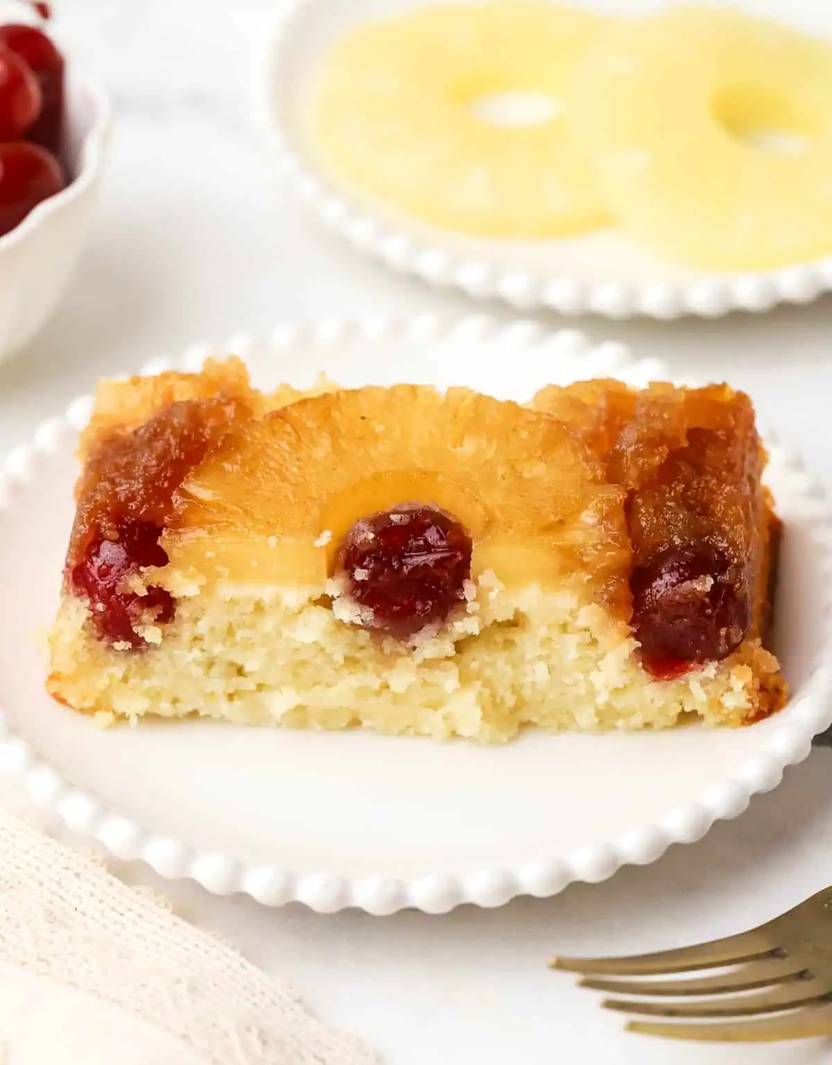 slice of small batch pineapple upside down cake on a plate