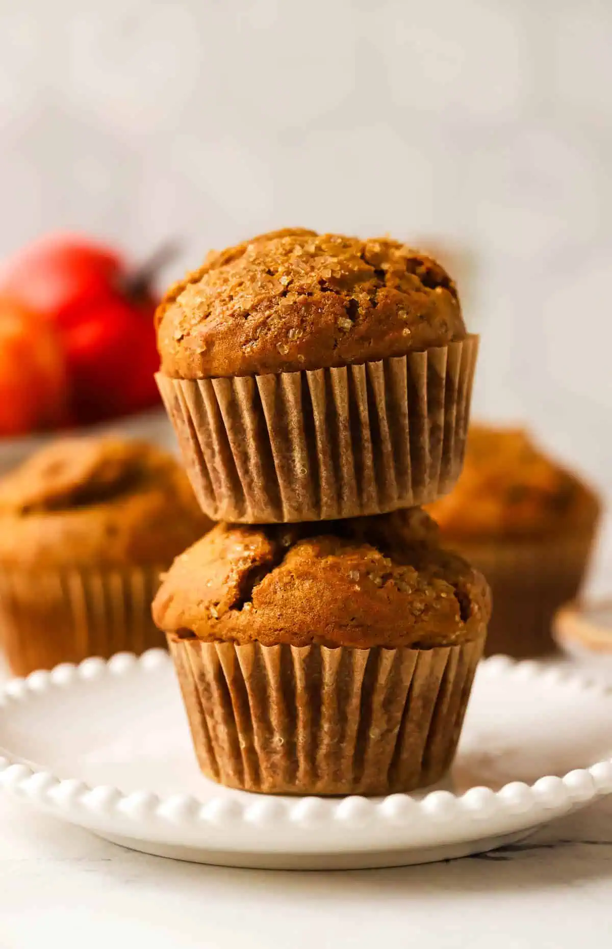 two pumpkin muffins stacked