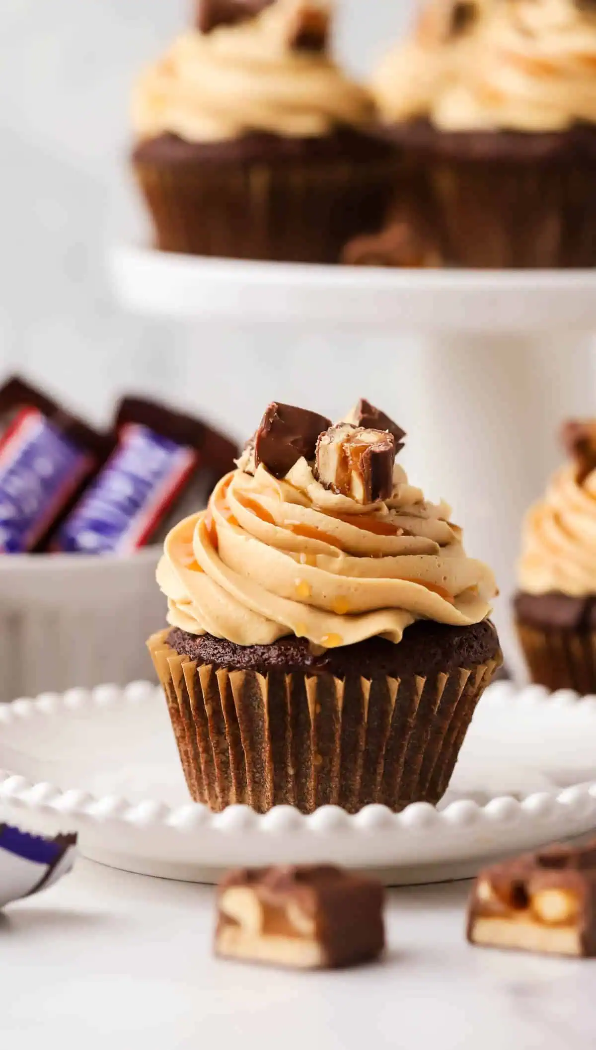 single snickers cupcake on a plate