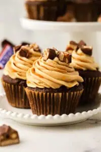 three Snickers cupcake on a plate
