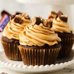 three Snickers cupcake on a plate